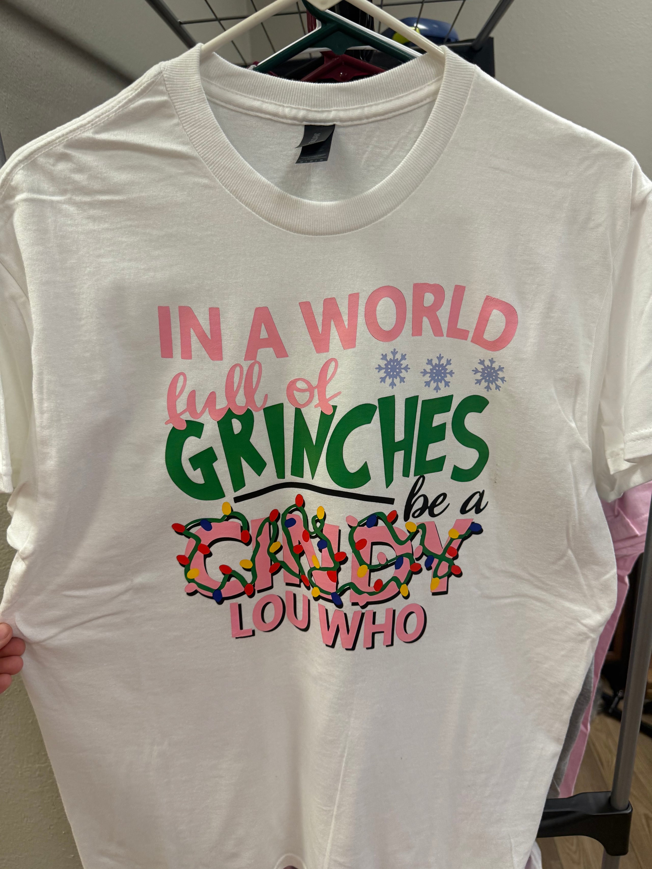 “In a world full of Grinches” Medium Tshirt