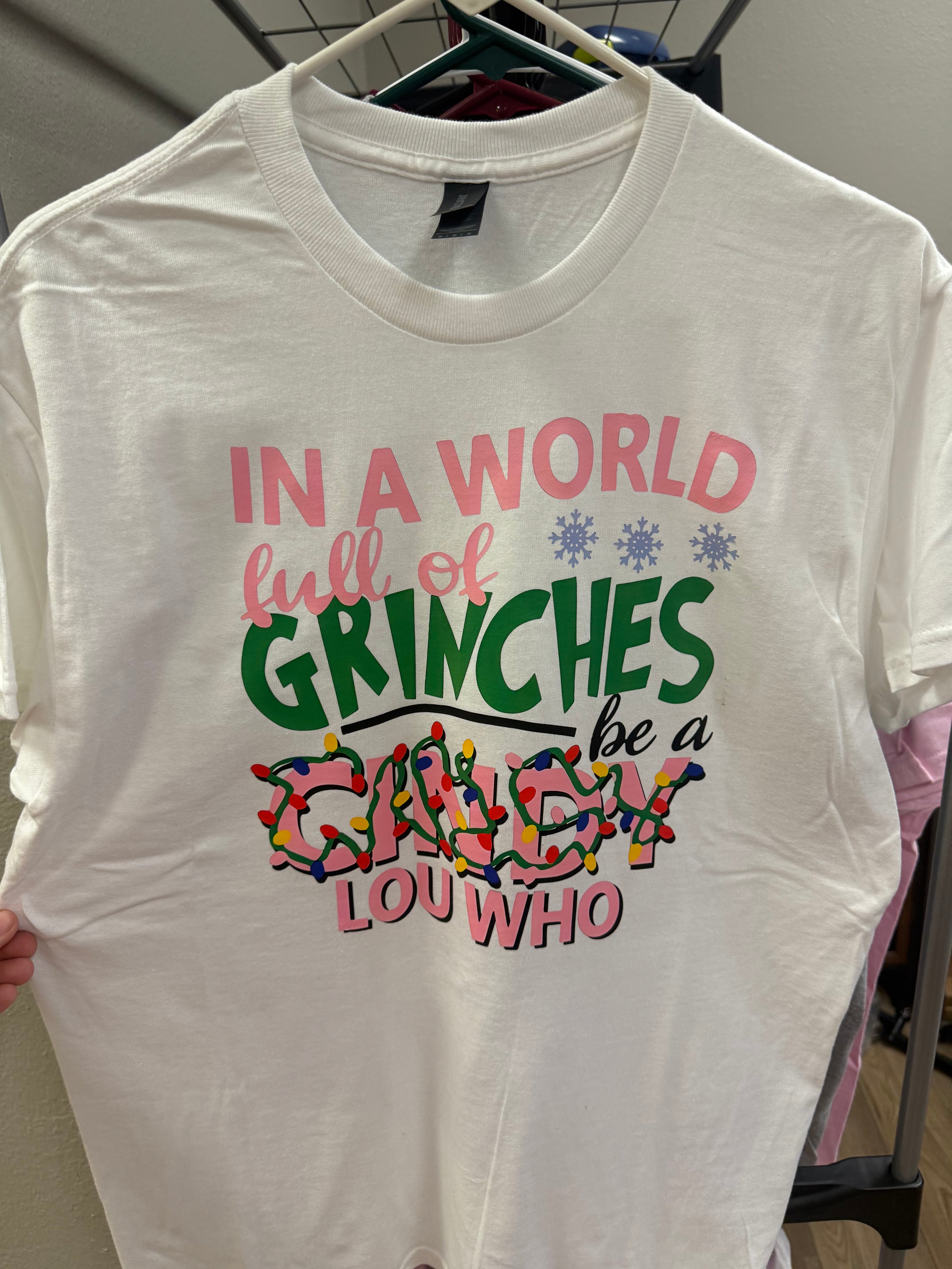 “In a world full of Grinches” Medium Tshirt